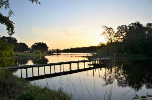 Lake Fork Farm Fishing is often great off our private 100' pier; this sunrise view looks north up Leafy Branch onto Lake Fork.