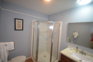 Lake Fork Farm | Bathroom.Fully equipped kitchen and dining area with large sleeper sofa in the living area